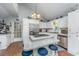 Bright kitchen features white cabinets, stainless steel appliances, island with bar stools, and vaulted ceiling at 1518 Southwick Dr, Johns Island, SC 29455