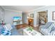 Stylish living room with cozy seating, hardwood floors, and large windows at 1518 Southwick Dr, Johns Island, SC 29455