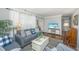 Comfortable living room with plush seating, hardwood floors, and ample natural light at 1518 Southwick Dr, Johns Island, SC 29455
