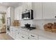 Modern kitchen featuring stainless steel appliances, white cabinets, and an eat in kitchen, perfect for entertaining at 152 Seaton St, Summerville, SC 29486