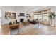 Spacious living room featuring built-in bookshelves, coffered ceilings, a fireplace, and ample natural light at 152 Seaton St, Summerville, SC 29486