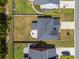 Aerial view showcases fenced backyard with patio and fire pit, complementing the home's roof and landscaping at 153 Lucca Dr, Summerville, SC 29486