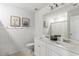 Bright bathroom featuring a double sink vanity, modern fixtures, framed art, and paneled walls at 153 Lucca Dr, Summerville, SC 29486