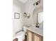 Cozy powder room featuring a round mirror, modern lighting, and a stylish vanity with neutral accents at 153 Lucca Dr, Summerville, SC 29486