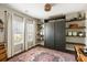Bedroom with a pull down bed, shelving, large windows with natural light and colorful rug at 153 Lucca Dr, Summerville, SC 29486