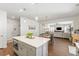 Open concept kitchen with white countertops, gray cabinets, pendant lights and views of the living and dining room at 153 Lucca Dr, Summerville, SC 29486