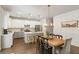 Well-lit kitchen featuring stainless steel appliances, a central island, and an inviting dining area at 153 Lucca Dr, Summerville, SC 29486