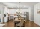 Stylish kitchen featuring white cabinetry, stainless steel appliances, and a dining area for Gathering gatherings at 153 Lucca Dr, Summerville, SC 29486