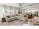 Bright and airy living room with a comfortable sectional sofa, natural light, and open floor plan at 153 Lucca Dr, Summerville, SC 29486