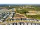 Aerial view of new homes, a retention pond, sports fields, and community amenities at 154 Helena Park Dr, Summerville, SC 29486