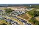 Aerial view of new home construction near retention ponds, schools, and wooded areas at 154 Helena Park Dr, Summerville, SC 29486