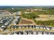 A scenic aerial view of a Primary-planned community featuring neighborhood ponds, tree-lined streets, and community recreation fields at 154 Helena Park Dr, Summerville, SC 29486