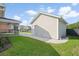 The backyard shows the detached garage, screened-in patio, lush lawn, and landscaping at 154 Helena Park Dr, Summerville, SC 29486