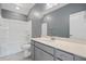 Bright bathroom featuring a gray wall, a white shower-tub combo, and a modern vanity with a white countertop and gray cabinets at 154 Helena Park Dr, Summerville, SC 29486