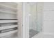 Bright bathroom includes a glass-enclosed shower with a view of a closet with shelving at 154 Helena Park Dr, Summerville, SC 29486