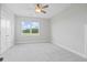 Neutral bedroom has one window with backyard views at 154 Helena Park Dr, Summerville, SC 29486