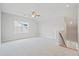 Spacious bonus room with plush carpet, a ceiling fan, and a window with shutters at 154 Helena Park Dr, Summerville, SC 29486