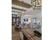 Spacious clubhouse with farmhouse tables, modern lighting fixtures, hardwood floors, and comfortable seating at 154 Helena Park Dr, Summerville, SC 29486
