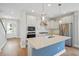 Bright, modern kitchen features an island with quartz countertops and stainless steel appliances at 154 Helena Park Dr, Summerville, SC 29486