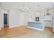 Spacious kitchen with an island that opens up into the dining and living room with bright natural light at 154 Helena Park Dr, Summerville, SC 29486