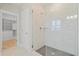 A glass enclosed shower with a tiled surround and a view of a walk-in closet at 154 Helena Park Dr, Summerville, SC 29486