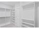 Spacious walk-in closet with white shelving and hanging rods for optimal storage at 154 Helena Park Dr, Summerville, SC 29486