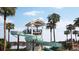 Resort style water slide is fun for all ages, surrounded by palm trees and overlooking the lake for a relaxing day at 154 Helena Park Dr, Summerville, SC 29486