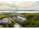 Stunning aerial view of waterfront condos with a bridge and cityscape in the background at 155 Wingo Way # 433, Mount Pleasant, SC 29464