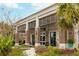 Attractive building featuring brick columns, large windows, and well-maintained landscaping at 155 Wingo Way # 433, Mount Pleasant, SC 29464