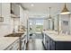 Beautiful kitchen featuring modern appliances, a stylish island with bar seating, and an open layout to the living area at 155 Wingo Way # 433, Mount Pleasant, SC 29464