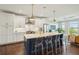 Modern kitchen featuring stainless steel appliances, a large island with seating, and bright white cabinetry at 155 Wingo Way # 433, Mount Pleasant, SC 29464