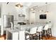 Modern kitchen with stainless steel appliances, bar seating, and sleek finishes for cooking and entertaining at 155 Wingo Way # 433, Mount Pleasant, SC 29464