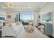 Spacious living room with modern decor, a large window with natural light, and stylish furniture at 155 Wingo Way # 433, Mount Pleasant, SC 29464