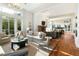 Bright lounge area with sofas, fireplace, and large windows creating a comfortable and welcoming space at 155 Wingo Way # 433, Mount Pleasant, SC 29464