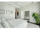 Bright main bedroom featuring modern furnishings, hardwood floors, and view to entry hall at 155 Wingo Way # 433, Mount Pleasant, SC 29464