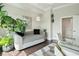 Bright office space featuring a daybed, modern desk and large window with greenery at 155 Wingo Way # 433, Mount Pleasant, SC 29464