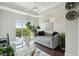 Bright office space featuring a daybed, modern desk and large window with lush green views at 155 Wingo Way # 433, Mount Pleasant, SC 29464