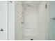Modern frameless walk-in shower with white subway tile and built-in seating at 155 Wingo Way # 433, Mount Pleasant, SC 29464