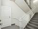 Modern staircase with white railing leading to upper floors of the building at 155 Wingo Way # 433, Mount Pleasant, SC 29464