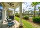 Relaxing backyard with covered patio and view of palm trees at 1623 Adventure Xing # 109, Mount Pleasant, SC 29466