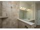 Modern bathroom boasting a sleek shower with a tile surround, glass partition, and brushed nickel fixtures at 1623 Adventure Xing # 109, Mount Pleasant, SC 29466