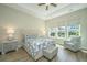 Cozy bedroom with tray ceilings, a decorative ceiling fan, and bright natural light at 1623 Adventure Xing # 109, Mount Pleasant, SC 29466
