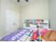 Bright bedroom featuring a built-in bookshelf and playful decor at 1623 Adventure Xing # 109, Mount Pleasant, SC 29466