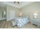 Bright bedroom with a bed, wood floors, and side tables with reading lamps at 1623 Adventure Xing # 109, Mount Pleasant, SC 29466