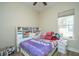 Stylish bedroom with a bed, storage cabinet, and natural light at 1623 Adventure Xing # 109, Mount Pleasant, SC 29466