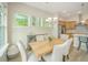 Dining room with wood table and chairs adjacent to the kitchen with stainless steel appliances at 1623 Adventure Xing # 109, Mount Pleasant, SC 29466