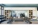 Modern gym featuring weights, yoga mats and towels, and a mirrored wall at 1623 Adventure Xing # 109, Mount Pleasant, SC 29466