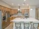 Spacious kitchen with stainless steel appliances, an island, and barstool seating at 1623 Adventure Xing # 109, Mount Pleasant, SC 29466