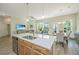 Bright kitchen island with white countertops offers seating and a modern sink at 1623 Adventure Xing # 109, Mount Pleasant, SC 29466