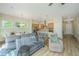 Open-concept living area features hardwood floors and plenty of natural light at 1623 Adventure Xing # 109, Mount Pleasant, SC 29466